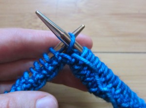 Step 3: Insert R needle into next st on L needle as if to purl that st. This is what "purlwise" (abbreviated pwise) means.