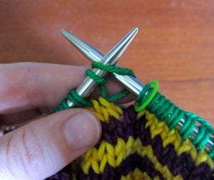 Begin Rnd 2: Knit into first loop of first stitch.