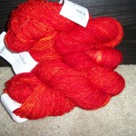 Tosh Merino Light in Tomato. A picture of "just yarn" or a sweater in the making?