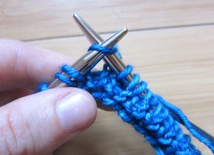Step 5: Return yarn to back of work and knit the next st.