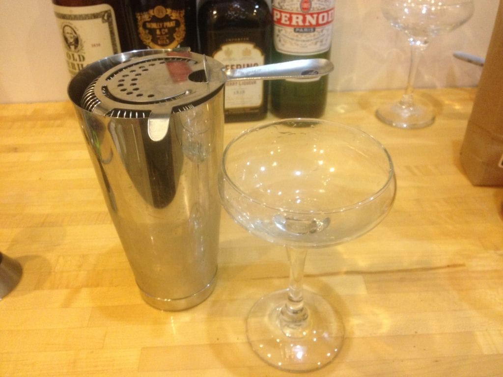 You can get a bar strainer like this at a good liquor store. 