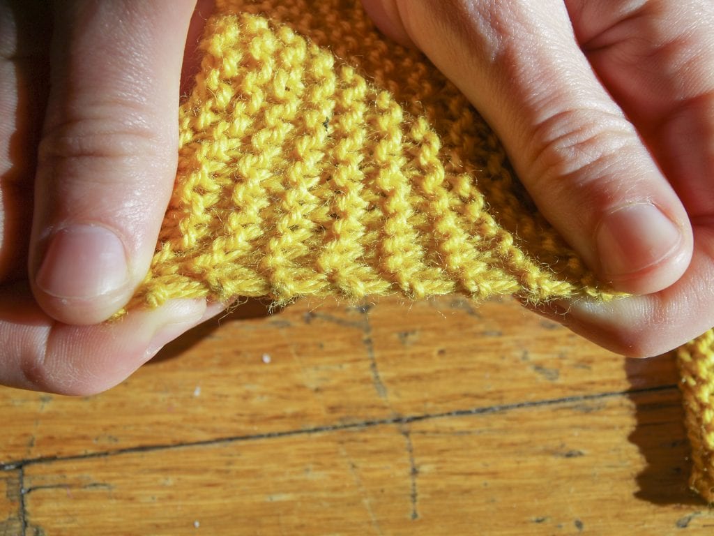 Slip first stitch purlwise with yarn in back.