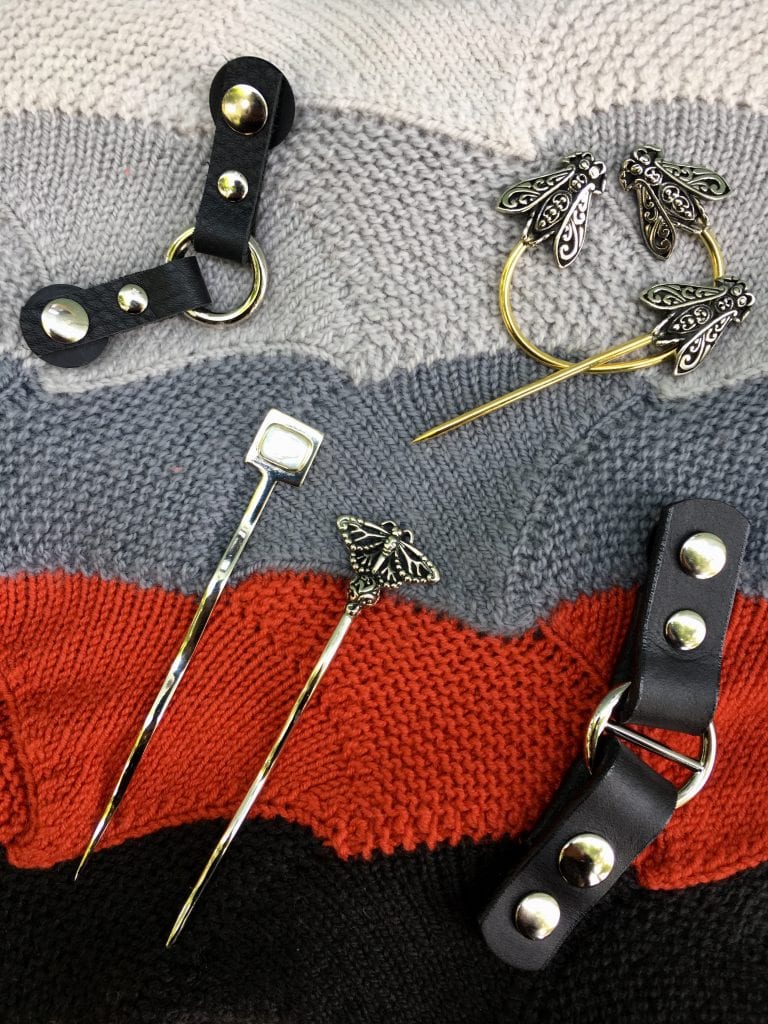image of shawl sticks and leather knit closures.