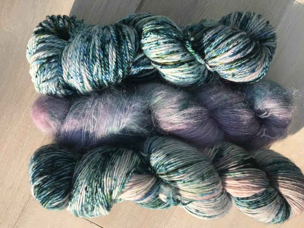 All three are Trellis colorway, from top: Velvet Aran, Mohair Silk, and Chandelier Fingering