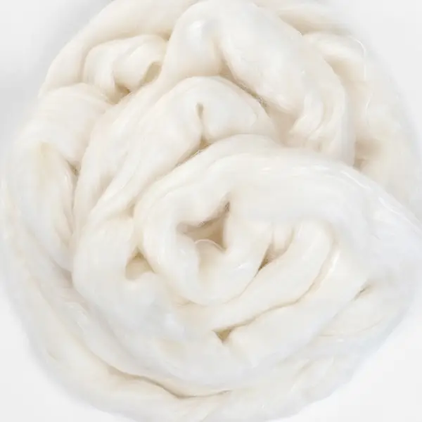 A swirl of shimmery undyed wool blended with silk.