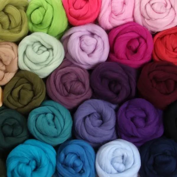 Swirls of unspun wool in assorted colors.