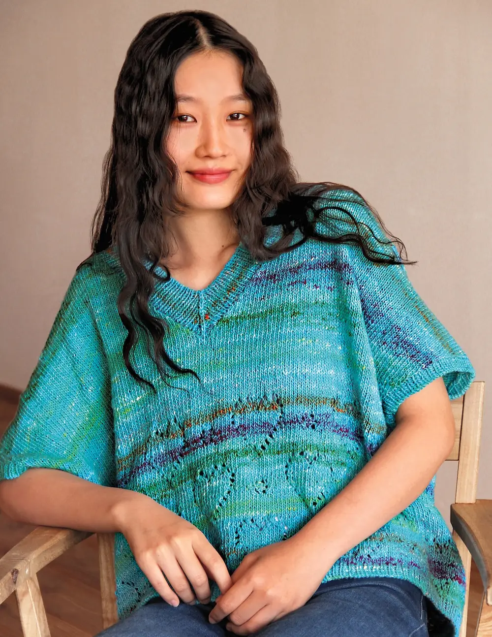 A caftan-inspired, V-neck summer top knitted with Noro Ohajiki yarn.