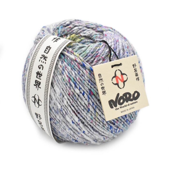 A ball of multicolored silk and wool yarn with paper labels