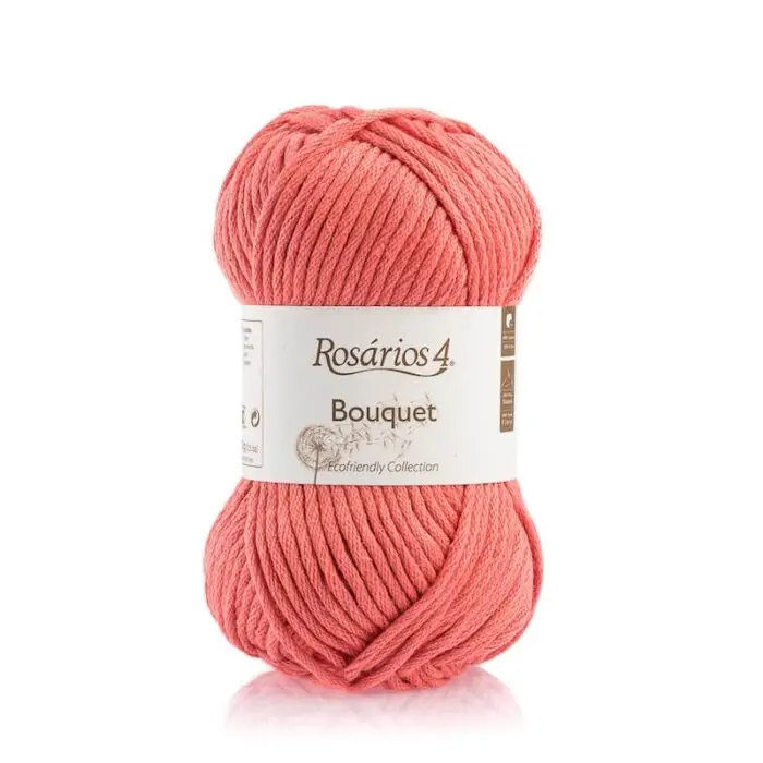A skein of Rosários 4 Bouquet yarn in bright coral.
