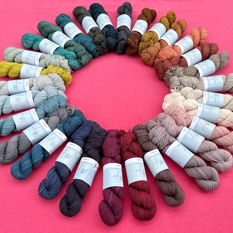 A circle of Little Fox Fennec yarn skeins.