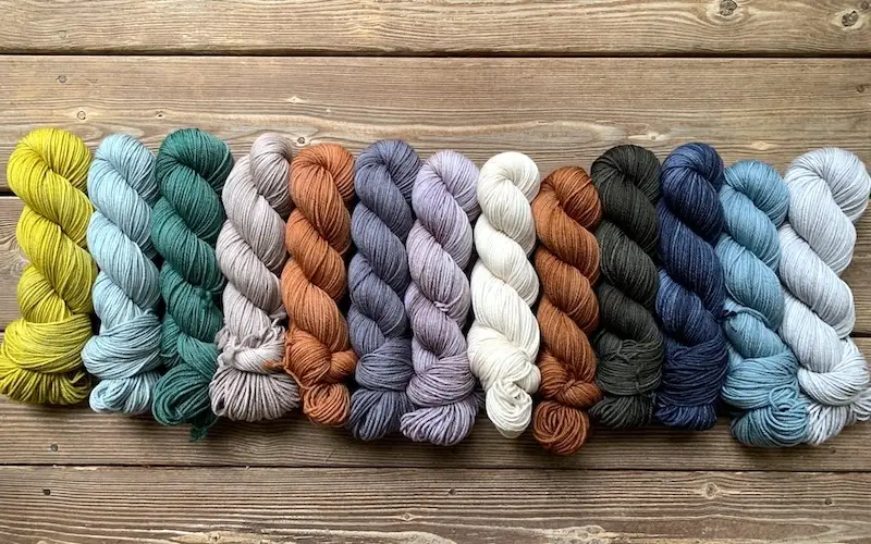 Skeins of Little Fox Yarn Fennec in assorted colors.