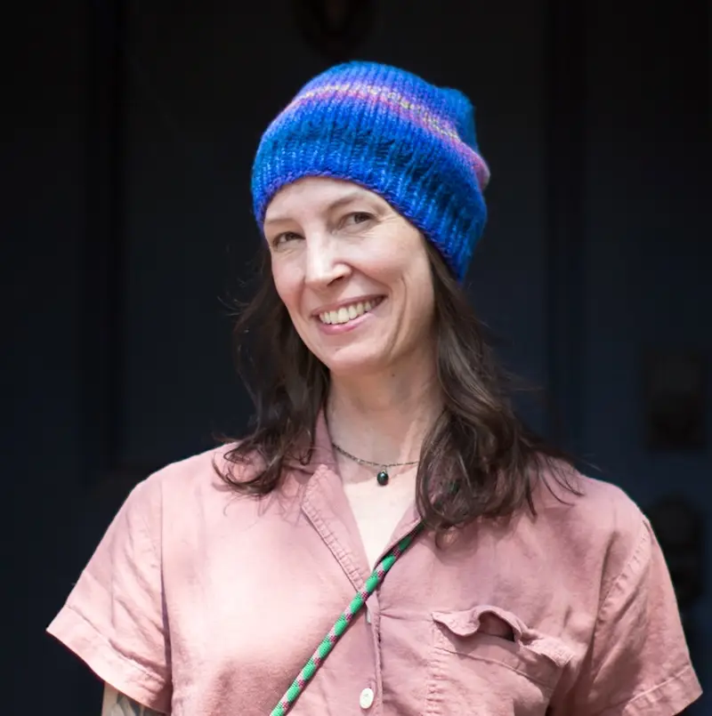 Danielle wears the Halo Beanie in Spincycle Yarns Plump.