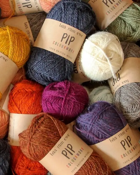 Skeins of Baa Ram Ewe Pip yarn in assorted colors.