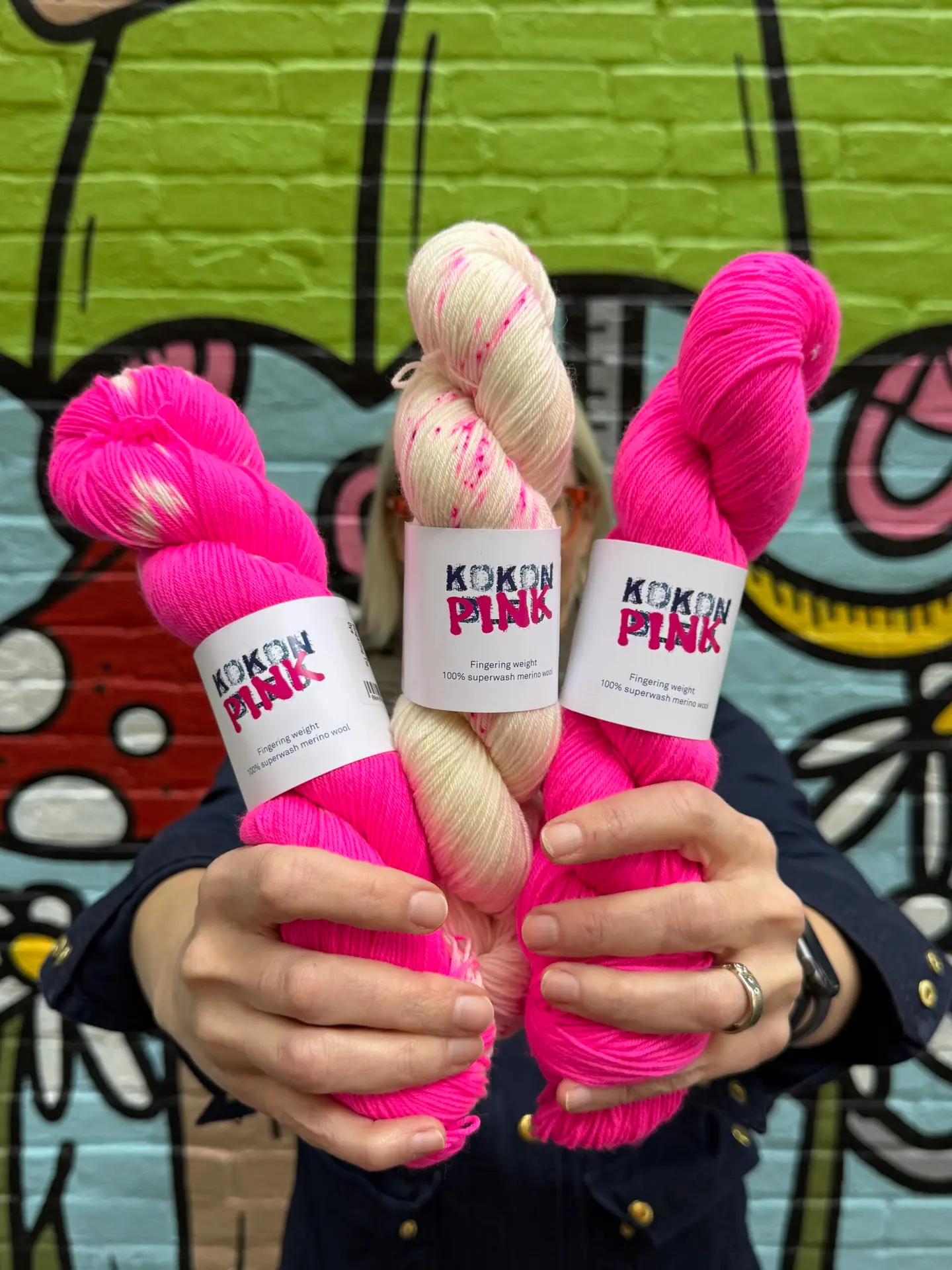 Kokon Pink fingering yarn in semi-solid, tie-dye, and speckled hot pink